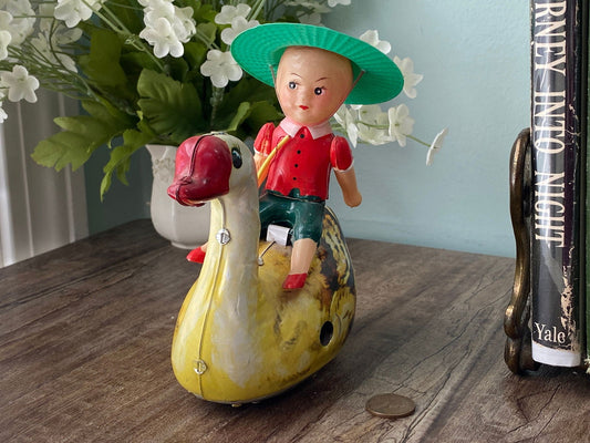 Vintage Boy Riding a Swan Tin Litho Toy at Duckwells