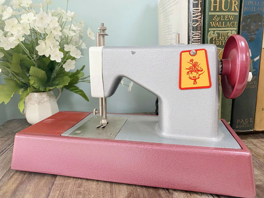 Vintage Toy Sewing Machine with Original Box and Instruction Sheet at Duckwells