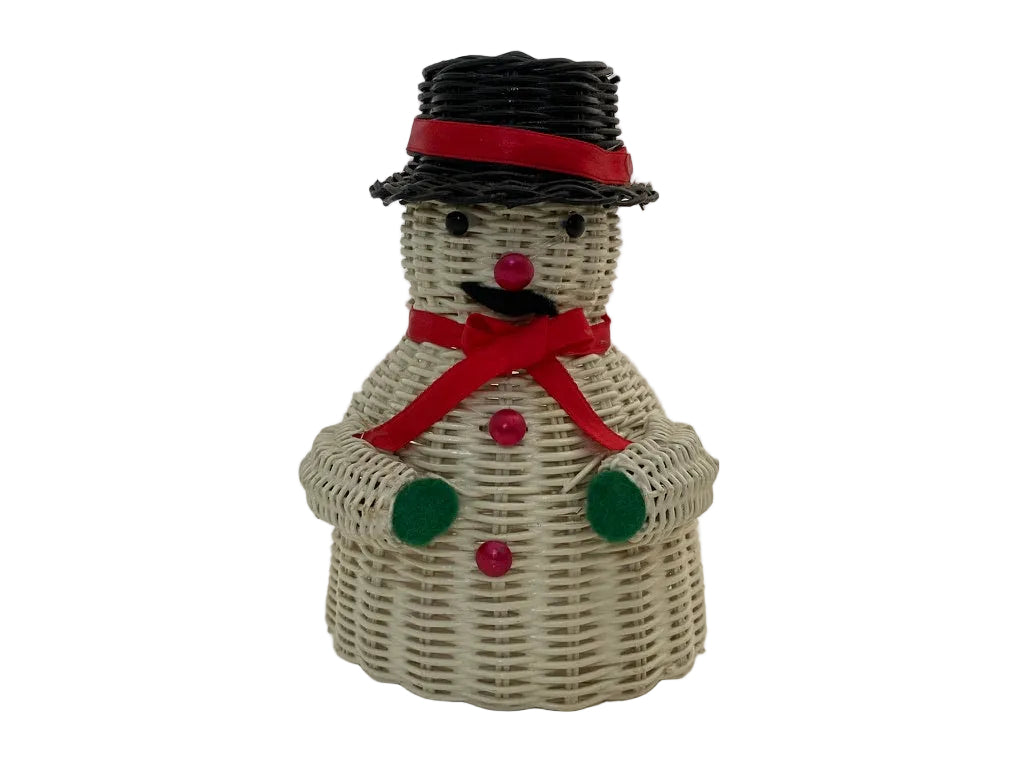 A snowman figurine made from woven white wicker, featuring a black hat with a red band, a red scarf, green buttons, and a red nose, set against a plain white background.