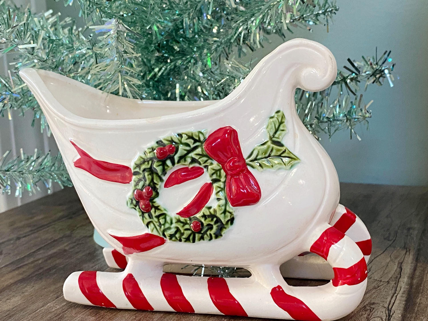 Vintage Ceramic Sleigh with Red and Green Details at Duckwells
