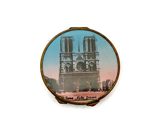 Compact mirror with Notre Dame Cathedral design on a white background