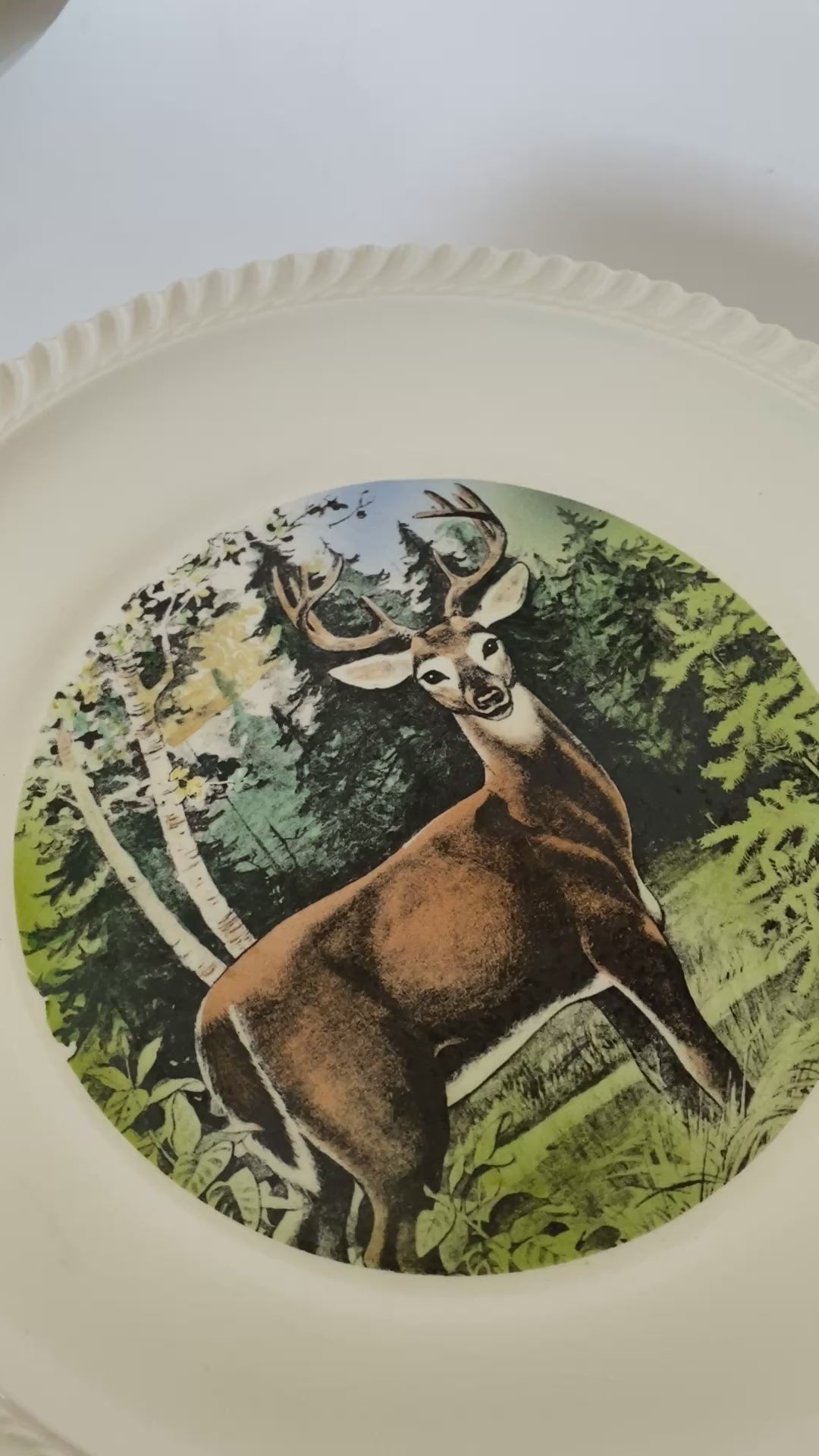 vintage ceramic plate with deer graphic