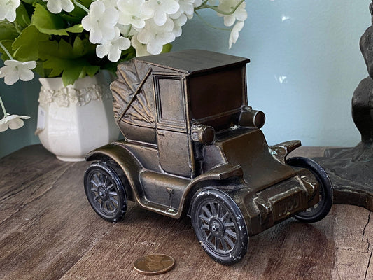 VIntage Car Cast Metal Advertising Coin Bank at Duckwells